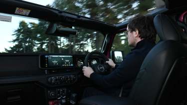 Auto Express consumer reporter Tom Jervis driving a Jeep Wrangler